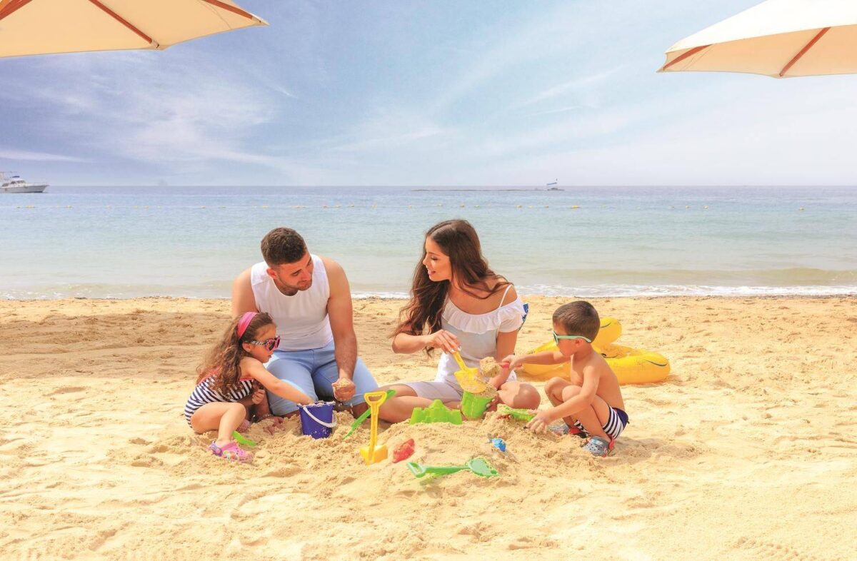 Aerial view of hot-air balloons floating over the rock formations of Wadi Rum at sunrise