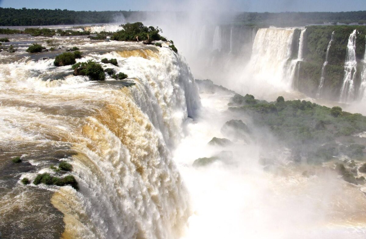 Aerial view of Iguazu Falls surrounded by lush rainforest