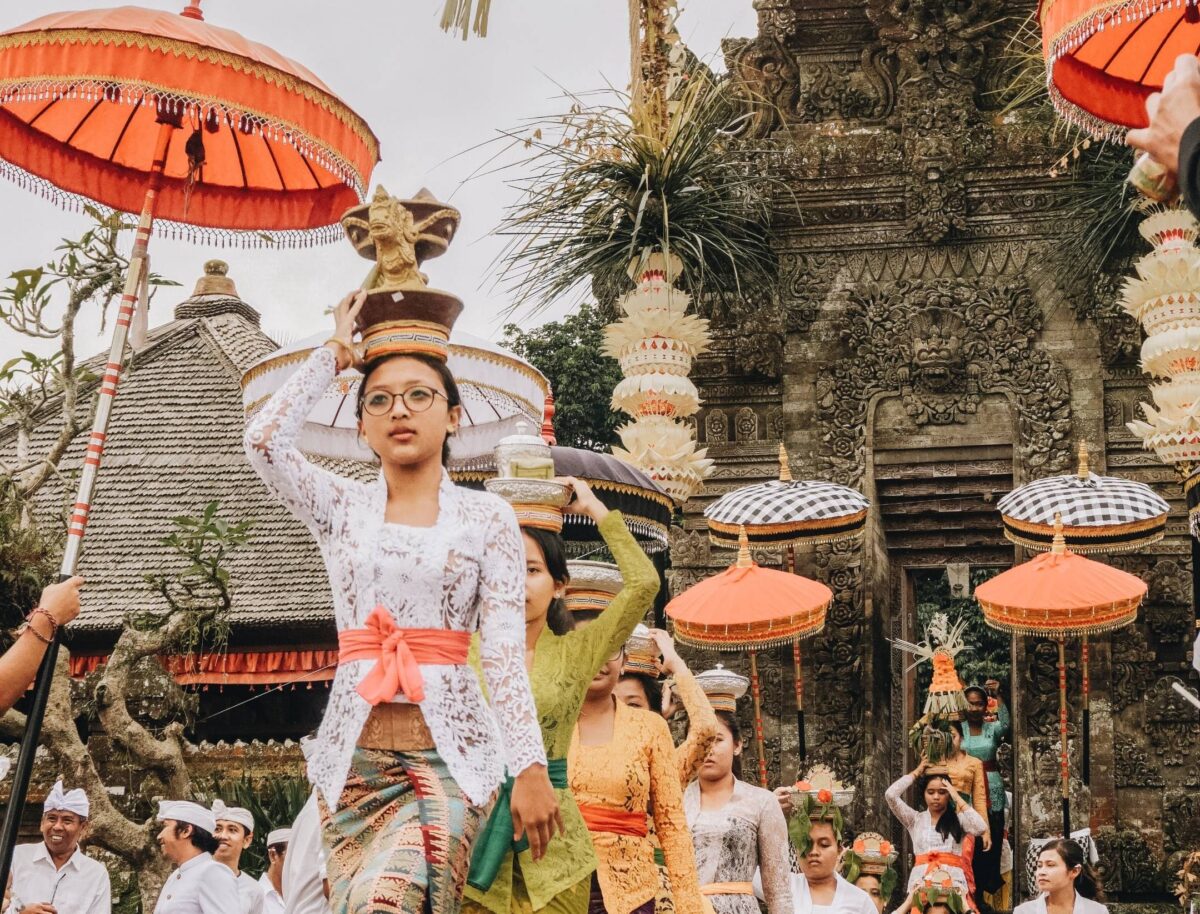 Airplane taking off from Denpasar Airport with Bali’s coastline and ocean in the background