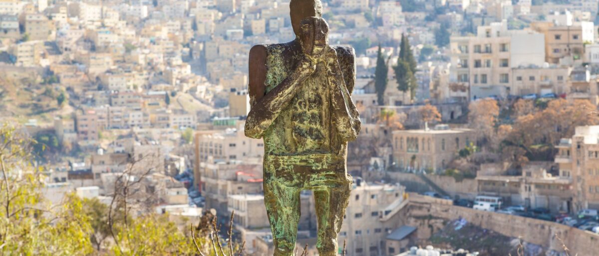 Airplane taking off over the Jordanian landscape at sunrise, symbolising the end of the journey