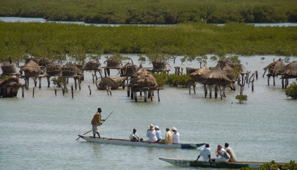 Beachfront resort in Saly, Senegal, with palm trees, sun loungers and calm Atlantic waters