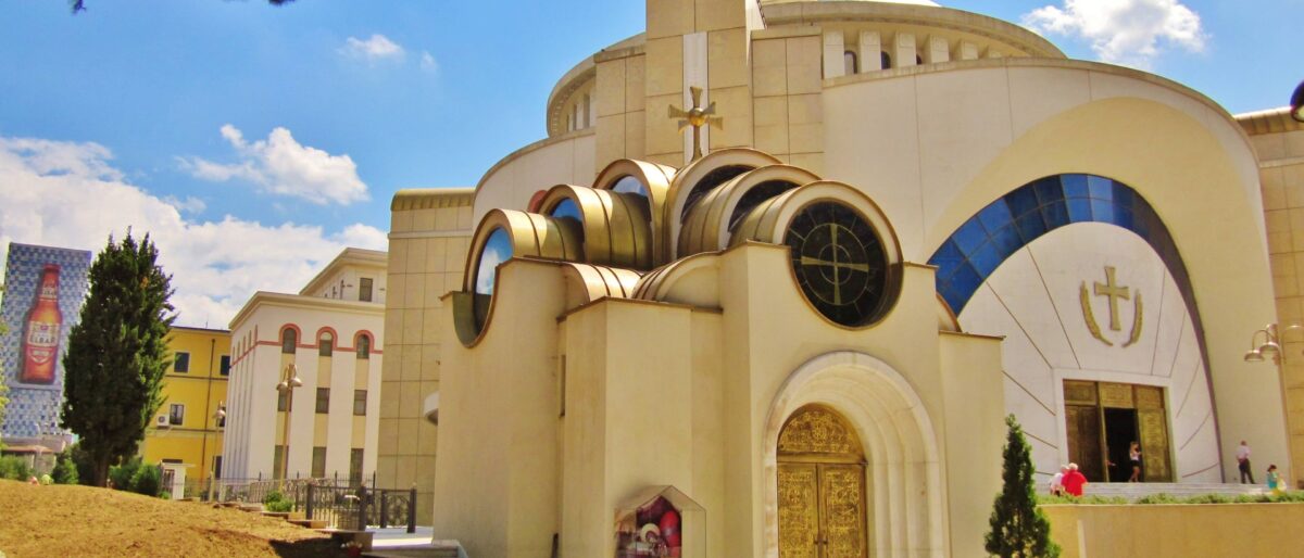 Central square in Tirana, Albania, with the clock tower, Et'hem Bey Mosque and modern buildings around