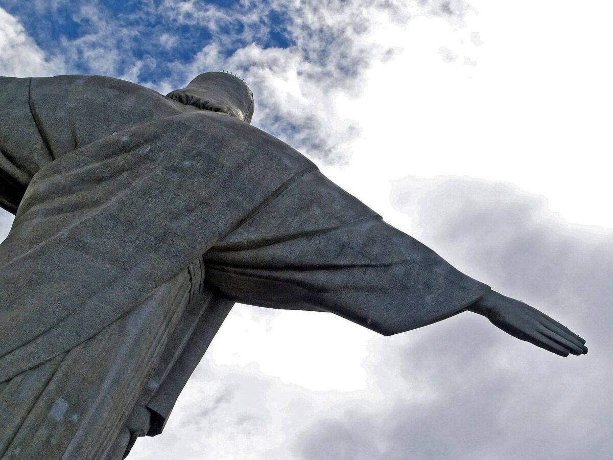 Christ the Redeemer statue towering above the forested Corcovado Mountain overlooking Rio de Janeiro