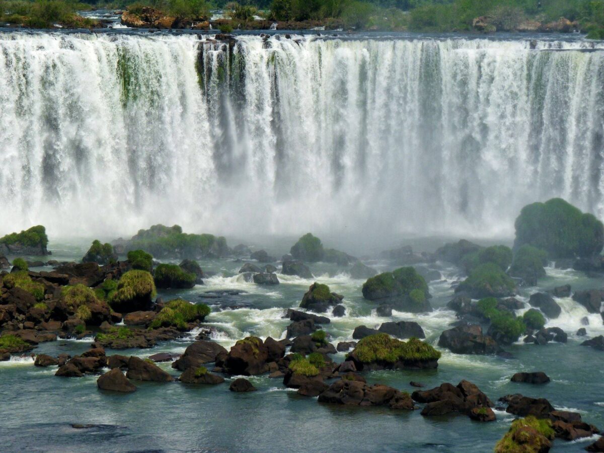 Close-up of the Devil’s Throat at Iguazu Falls with mist rising