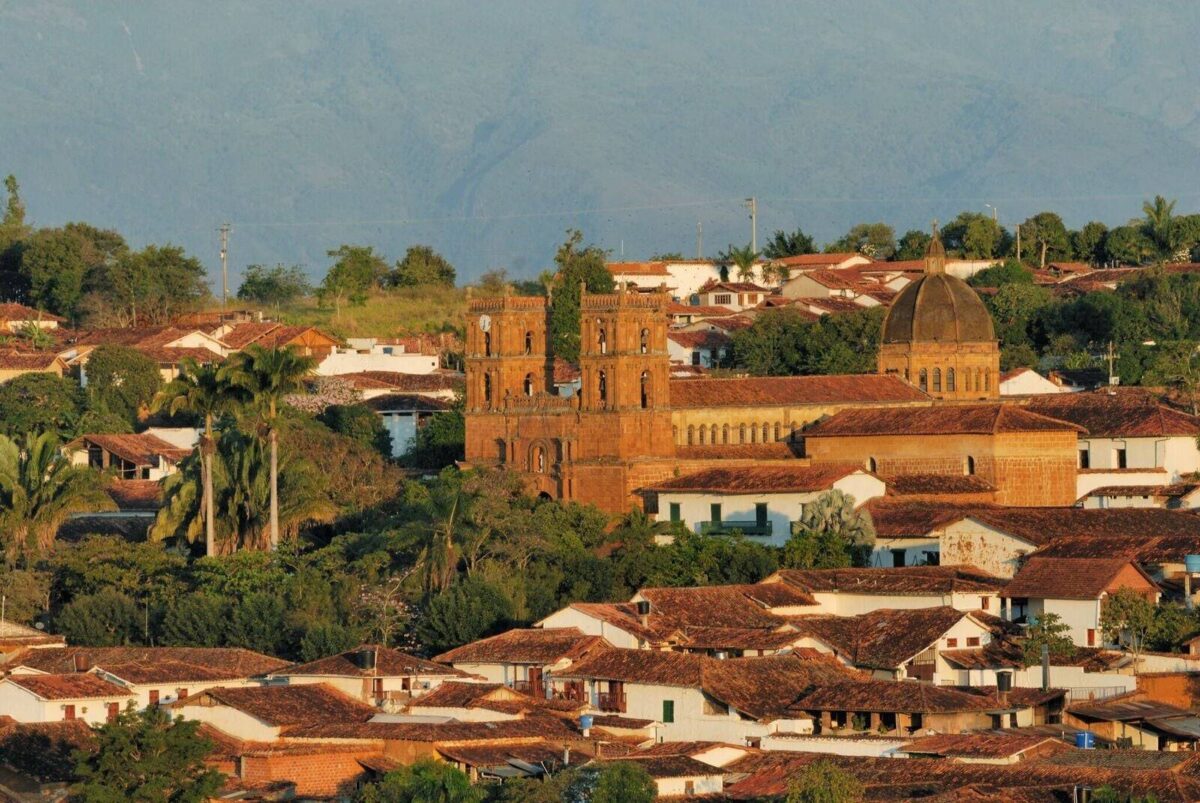 Colonial street in Barichara with whitewashed houses, red-tiled roofs and distant canyon views