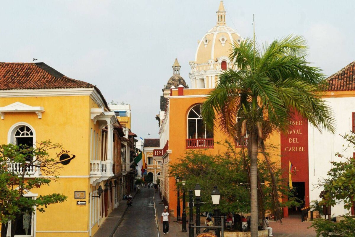 Colorful colonial buildings and a church tower in Cartagena’s historic walled city near the Caribbean Sea