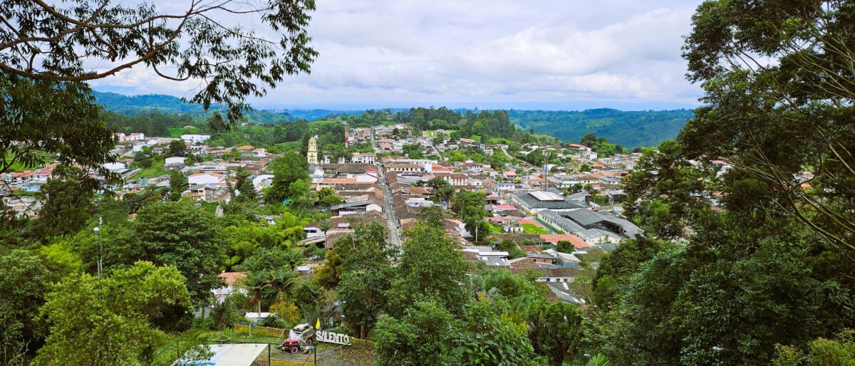 Colorful colonial houses with wooden balconies lining a street in Salento in the Colombian Coffee Region