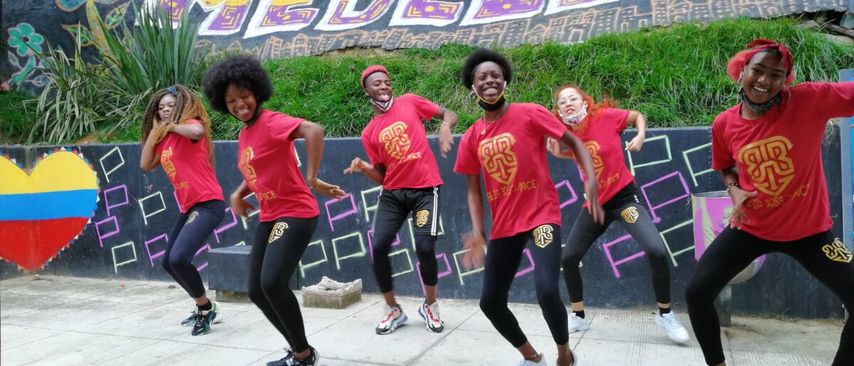 Colorful graffiti murals and outdoor escalators in Comuna 13 in Medellín