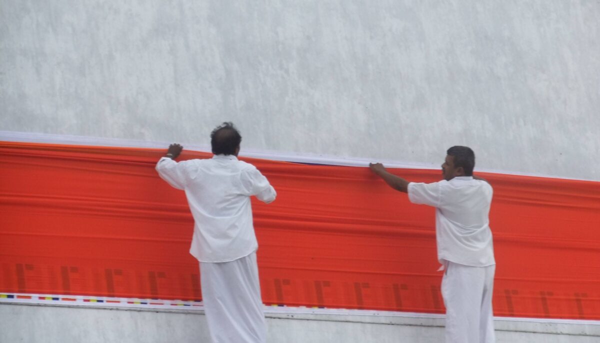Cyclists passing ancient stupas and ruins in the archaeological park of Anuradhapura in Sri Lanka