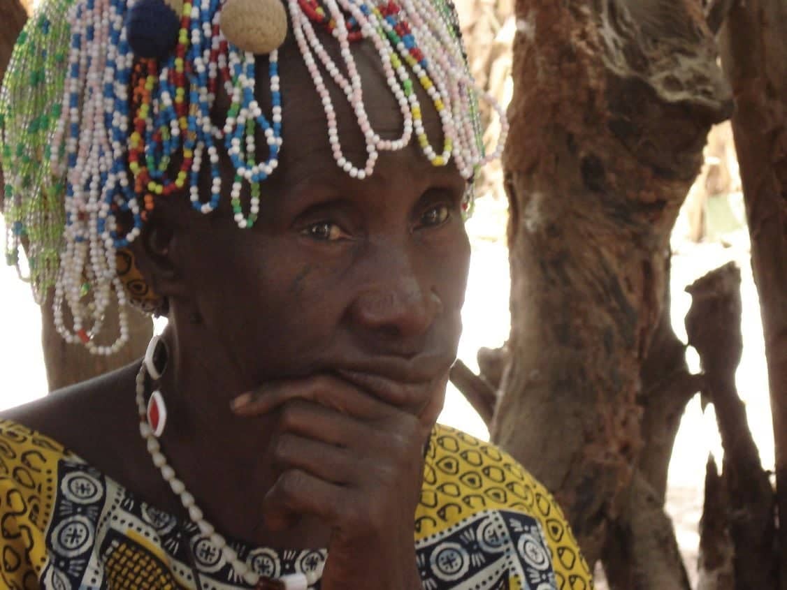 Diola villagers in traditional dress performing a mask dance in a Casamance village