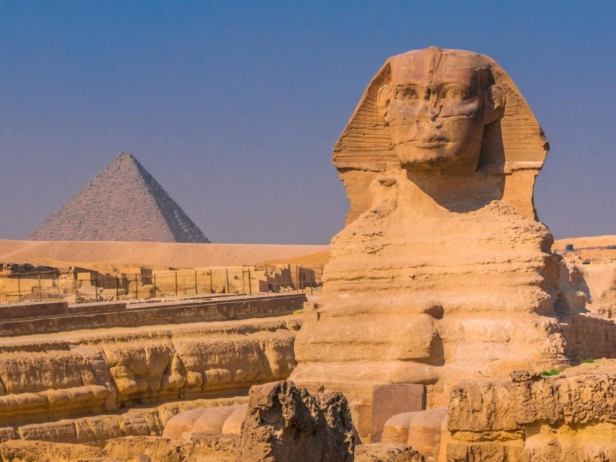 Evening view of Cairo with city lights and traffic near the pyramids area