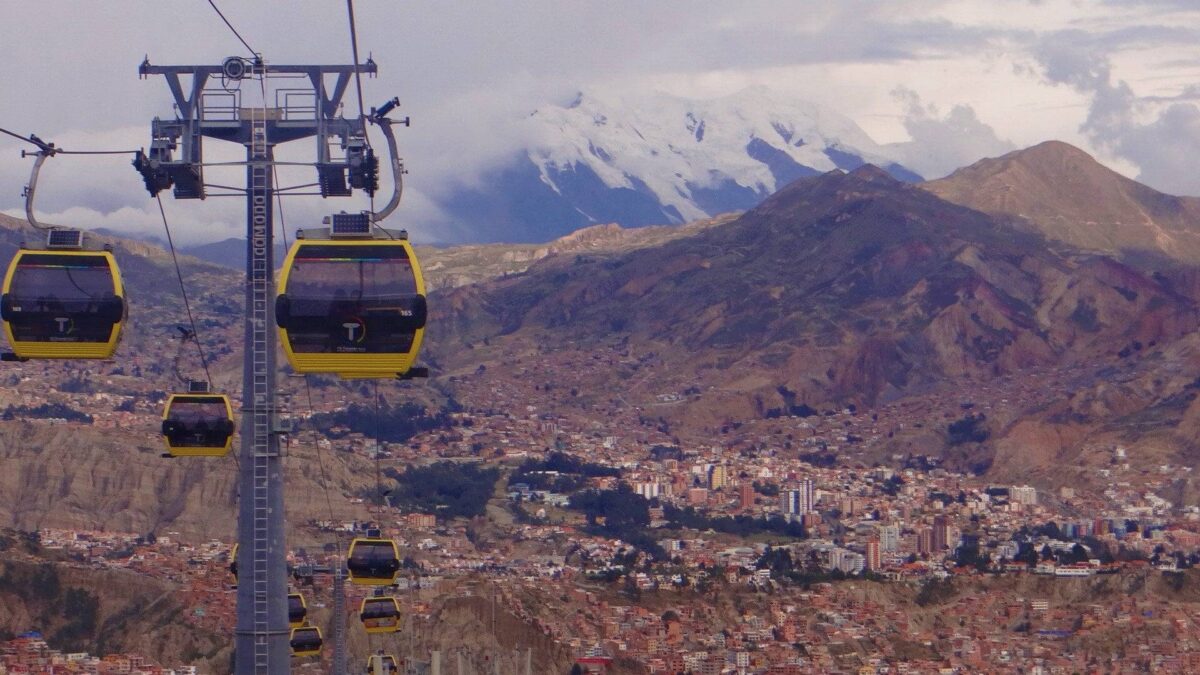 Evening view over La Paz, Bolivia, with city lights climbing the surrounding Andean hills and mountains in the background