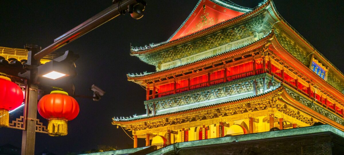 Family standing on Xi’an’s ancient city wall, looking over the city skyline before continuing their journey