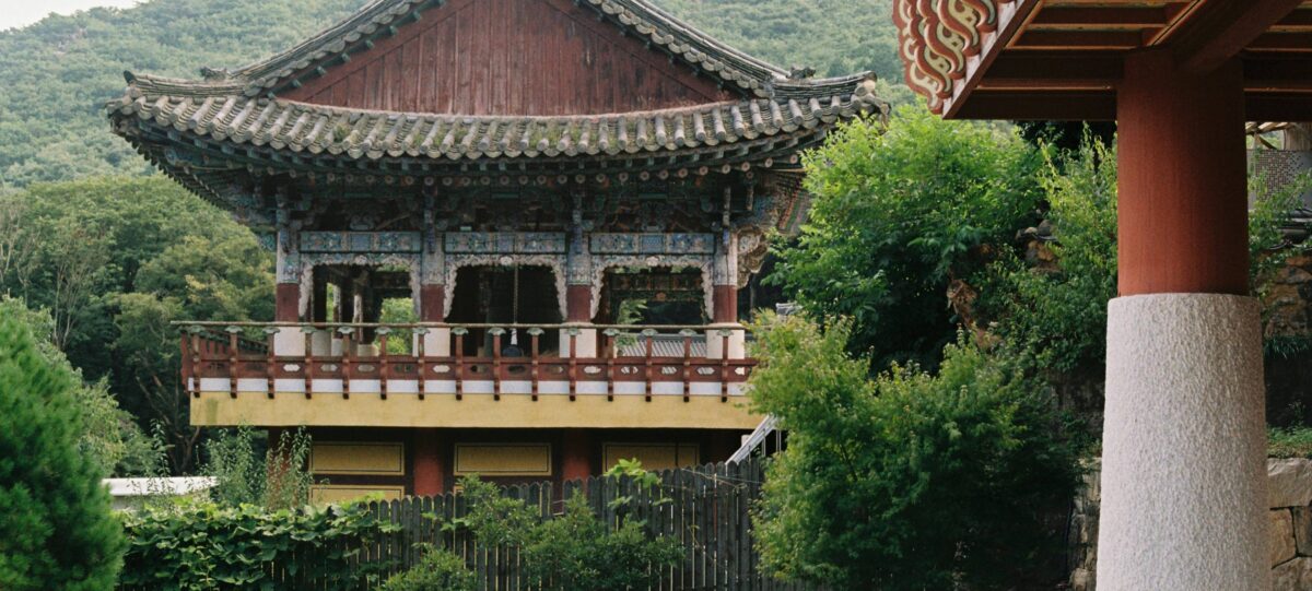 Family walking along the cobbled streets of Pingyao old town, surrounded by traditional wooden houses and red lanterns
