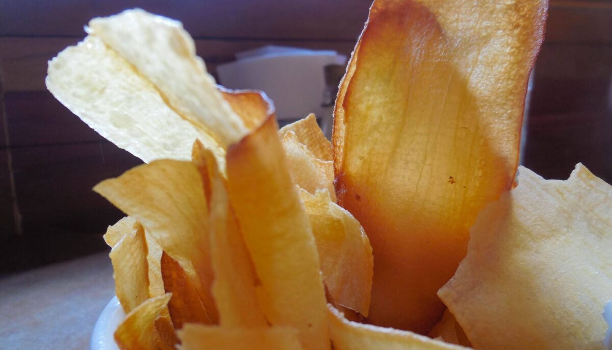 Indigenous family in a traditional wooden house in the Amazon rainforest