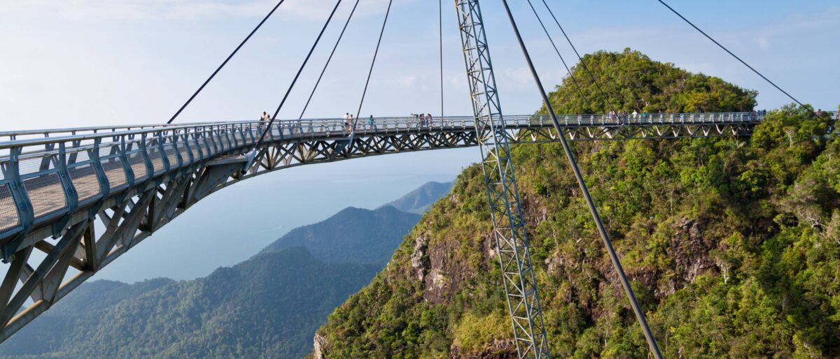 Langkawi Sky Bridge curving above lush green mountains with sea views