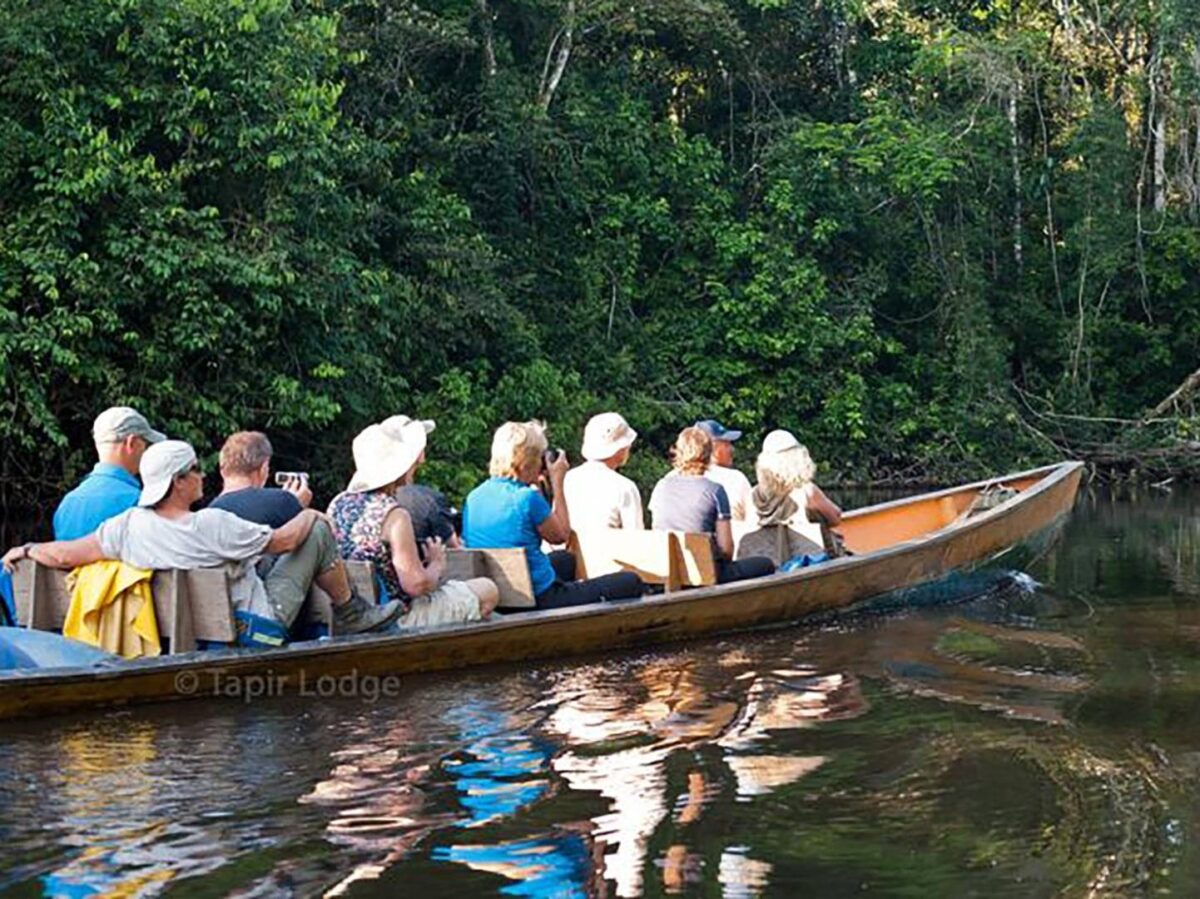 Members of the Siona community demonstrating traditional cassava bread making in an Amazon village