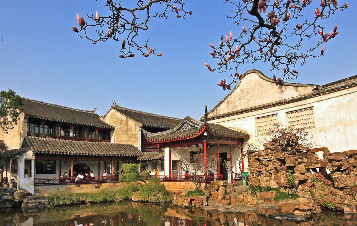 Modern skyline of Shanghai at dusk with illuminated skyscrapers and the Huangpu River
