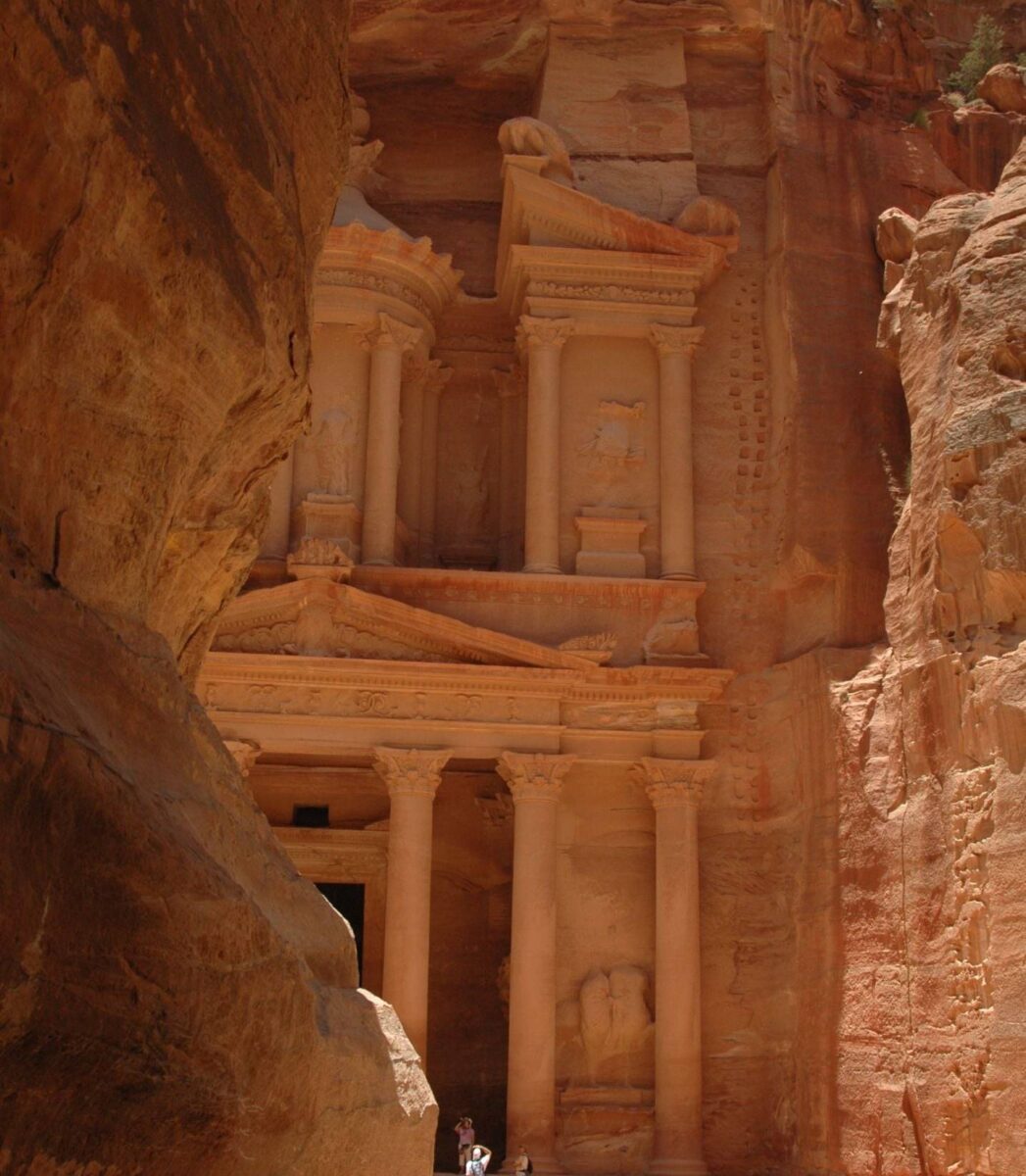 Narrow gorge leading to Petra’s Treasury carved into rose-red rock
