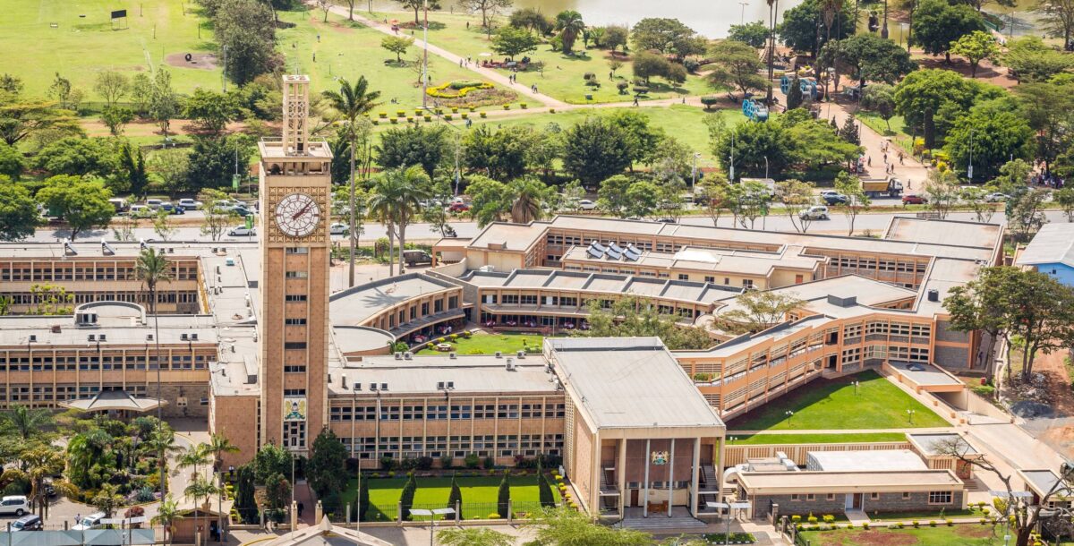 Night view of Nairobi skyline with illuminated high-rise buildings and traffic lights