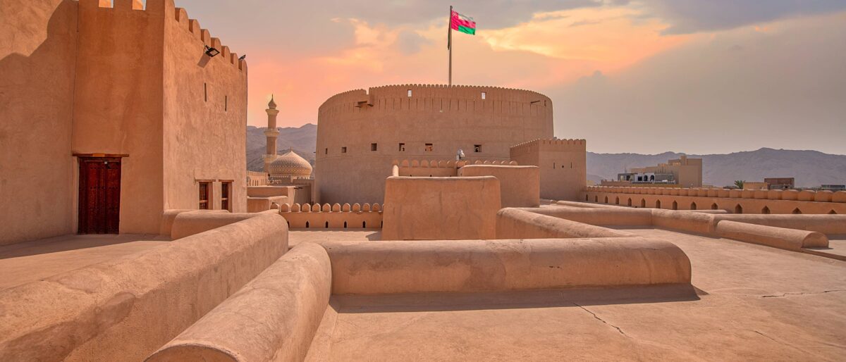 Nizwa Fort in Oman with its round tower and surrounding oasis town