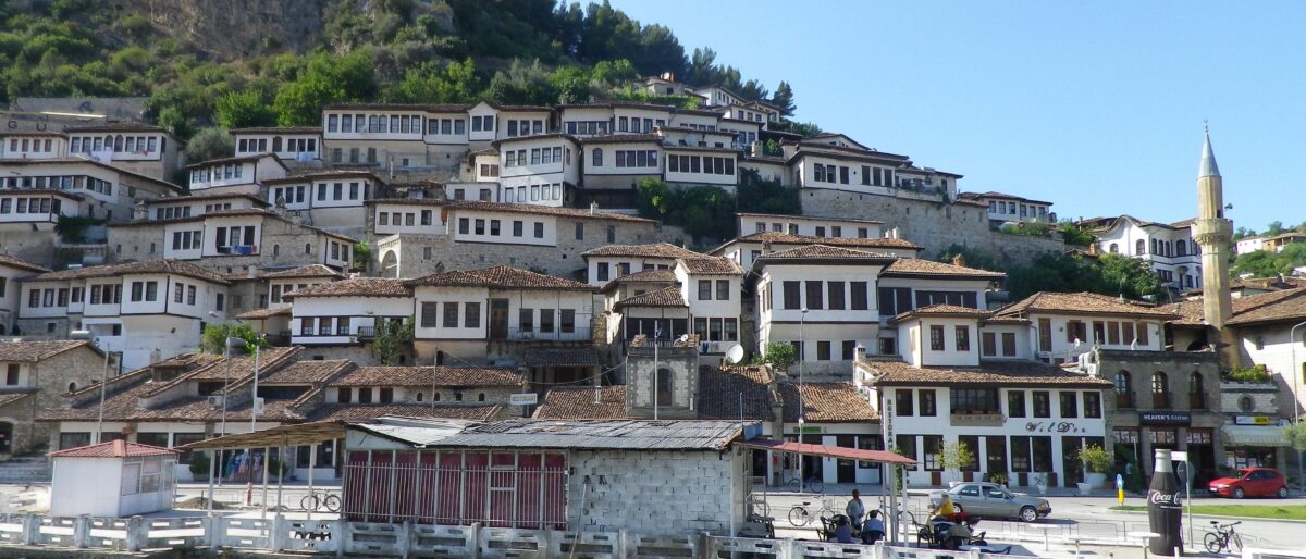 Panoramic view of Berat with white Ottoman houses and fortress on the hill above the river in Albania