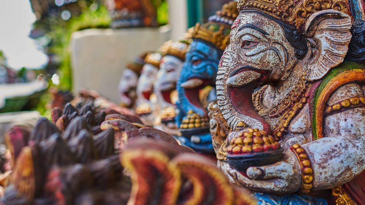 Parents and children relaxing at a pool overlooking tropical greenery near Ubud