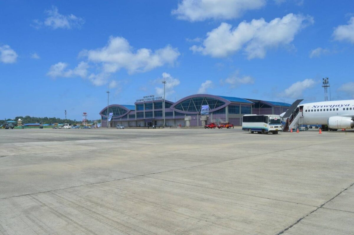 Passenger boat crossing calm blue water from Raja Ampat back towards the port of Sorong