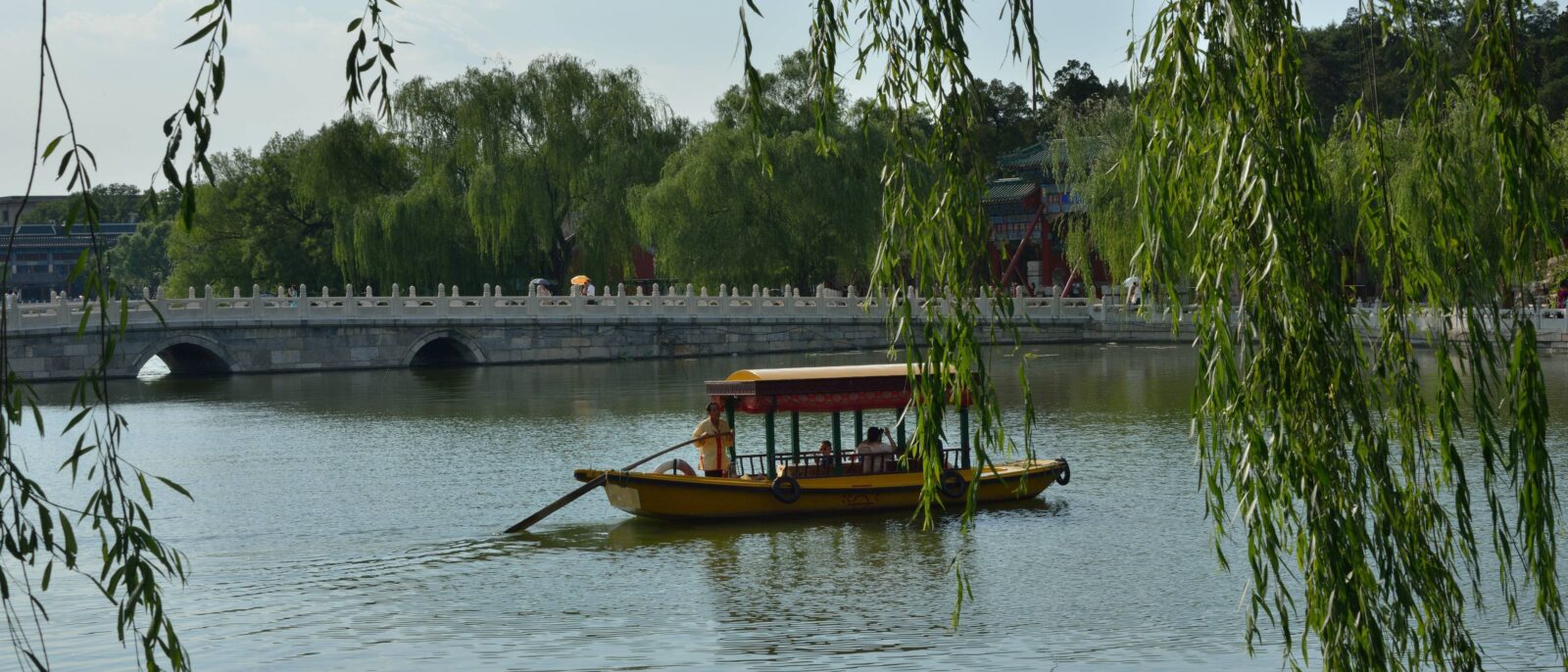View of central Beijing with wide avenues, trees and modern buildings at sunset