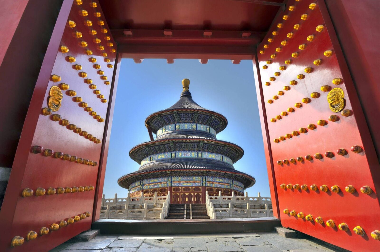 Panoramic view over central Beijing with historic rooftops and modern skyline at sunset