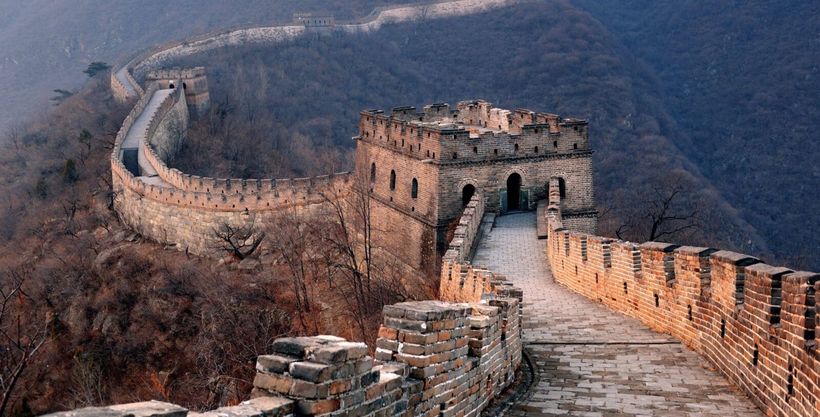 Scenic stretch of the Great Wall of China at Gubeikou snaking over green mountain ridges
