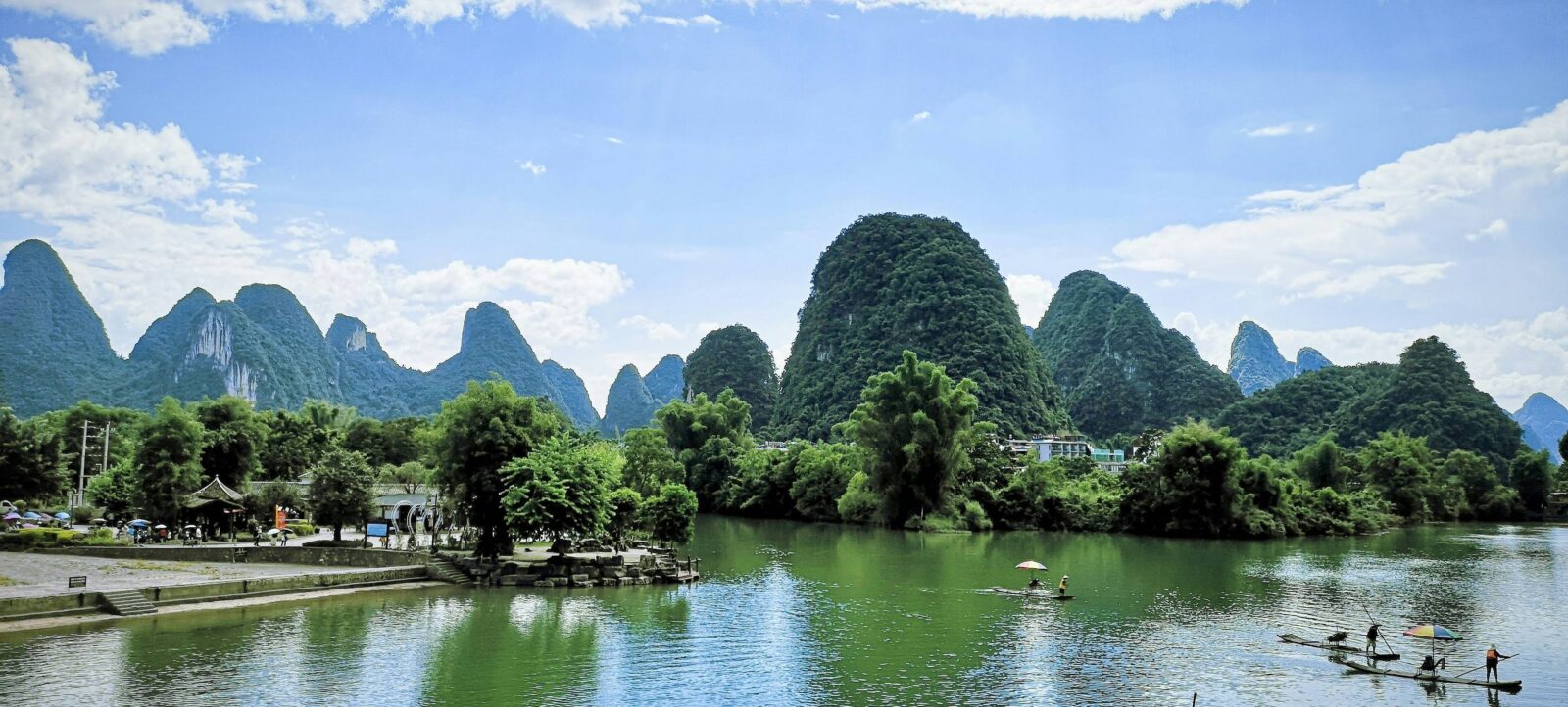 High-speed train passing through the karst mountain landscape near Guilin, viewed from a family’s window seat