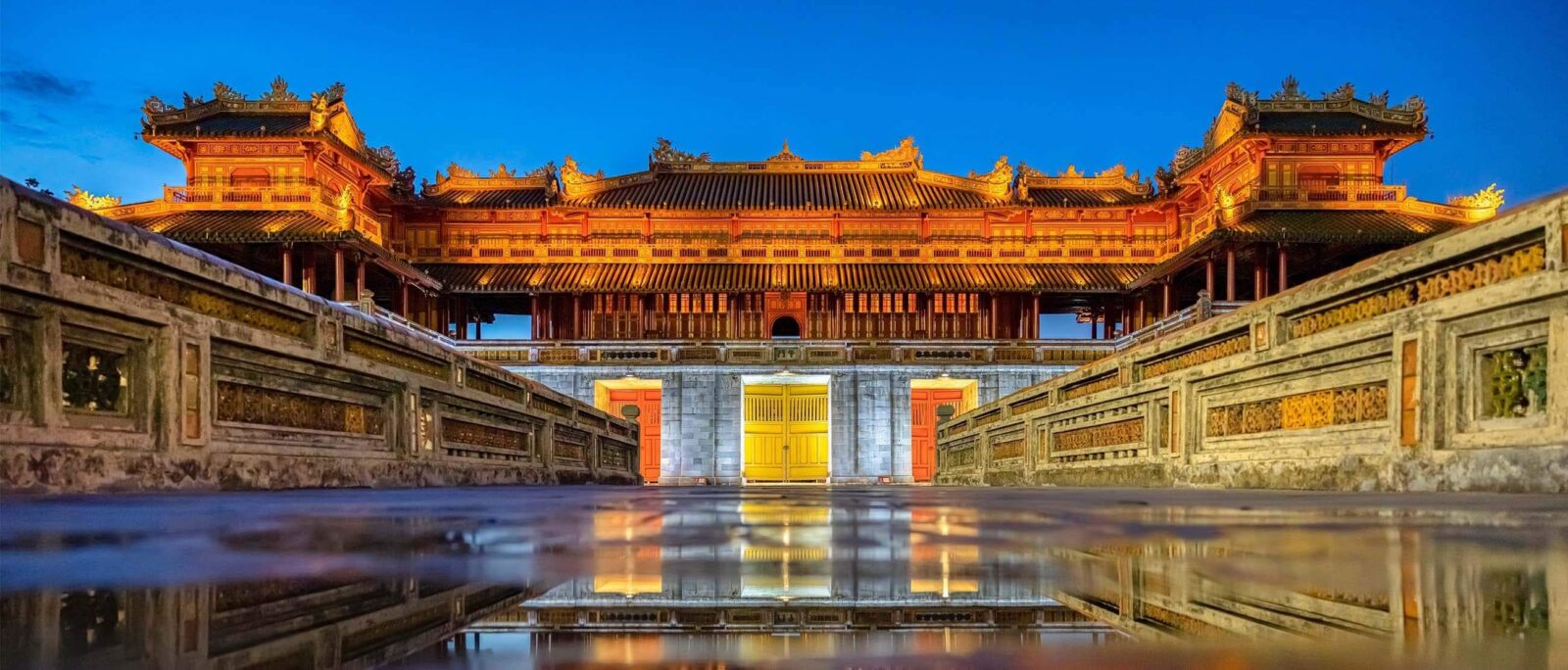 Ancient gate and walls of the Imperial Citadel in Hue, Vietnam under a blue sky