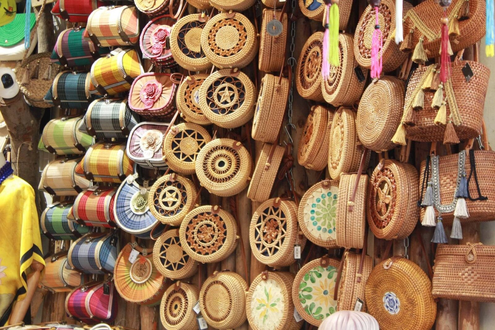 Small wooden boat navigating a narrow palm-lined canal in the Mekong Delta near Cai Be, Vietnam