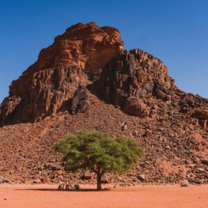 Panoramic view of Jordan’s desert mountains under a clear sky, symbolising the start of a sustainable journey through the country