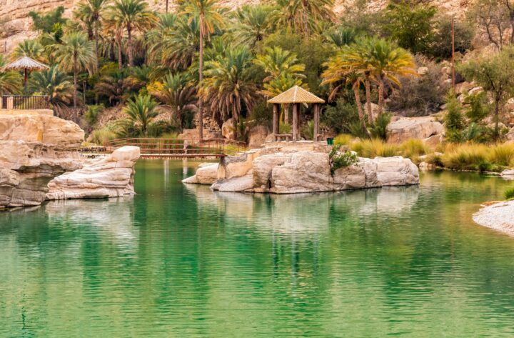 Panoramic view over the rugged cliffs and deep canyon of Jabal Shams in northern Oman under a clear blue sky