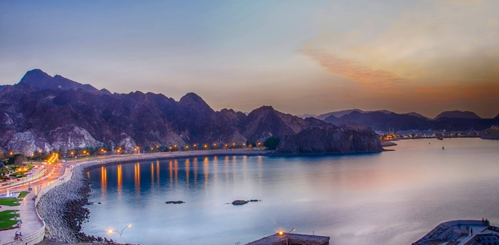 View over the oasis town of Fanja in Oman with palm groves, mud-brick houses and surrounding mountains