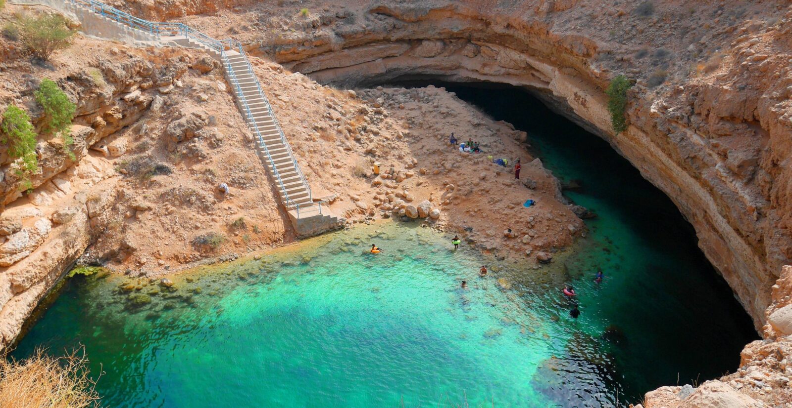 Coastal landscape near Sur, Oman, with turquoise sea, white sand beach and rocky cliffs