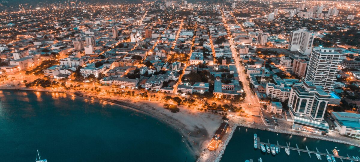 Remote palm-fringed sandy beach on Colombia’s Caribbean coast near Tayrona at sunset