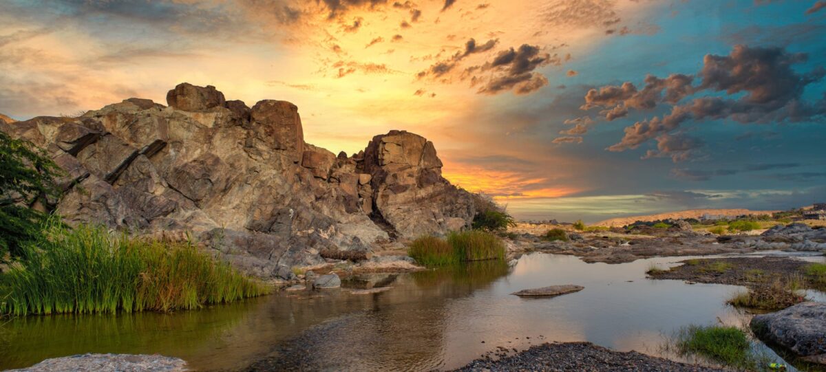 Rocky canyon landscape at Jabal Shams with deep gorge and mountain plateau in Oman