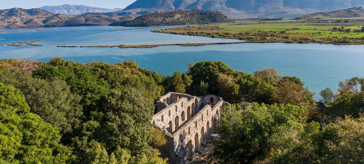 Ruins of the ancient theatre at Butrint surrounded by greenery near the lagoon in southern Albania