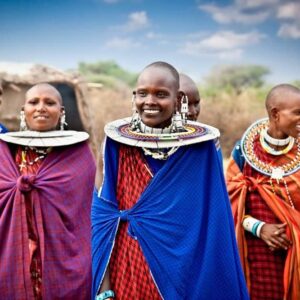 Safari vehicle parked in front of acacia trees at sunset in a Tanzanian savannah landscape