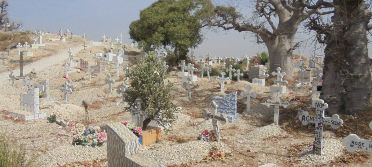 Shell island Joal-Fadiouth connected by footbridge, with colourful pirogues and village houses