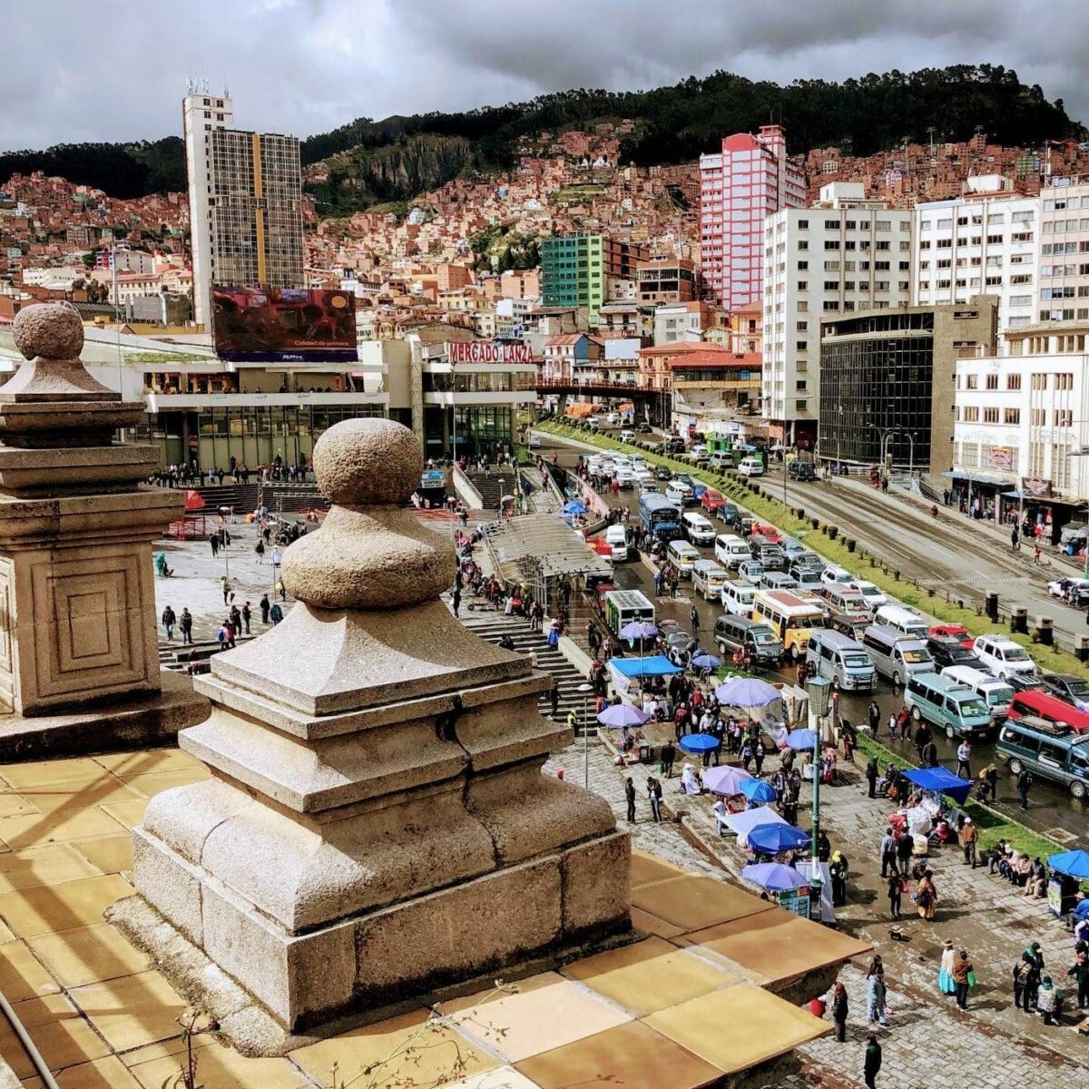 Small aircraft on the runway at Rurrenabaque airport with green Amazon hills in the background, Bolivia