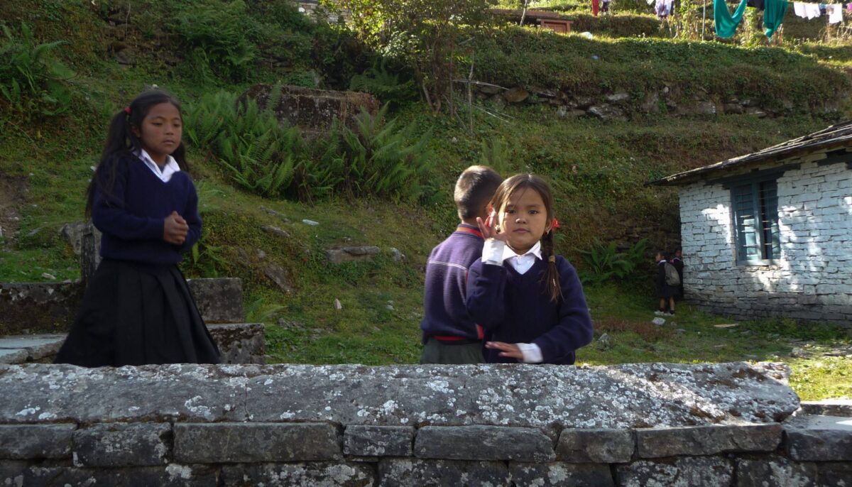Steep river gorge with waterfall and a narrow trekking path cut into the slope near Deurali