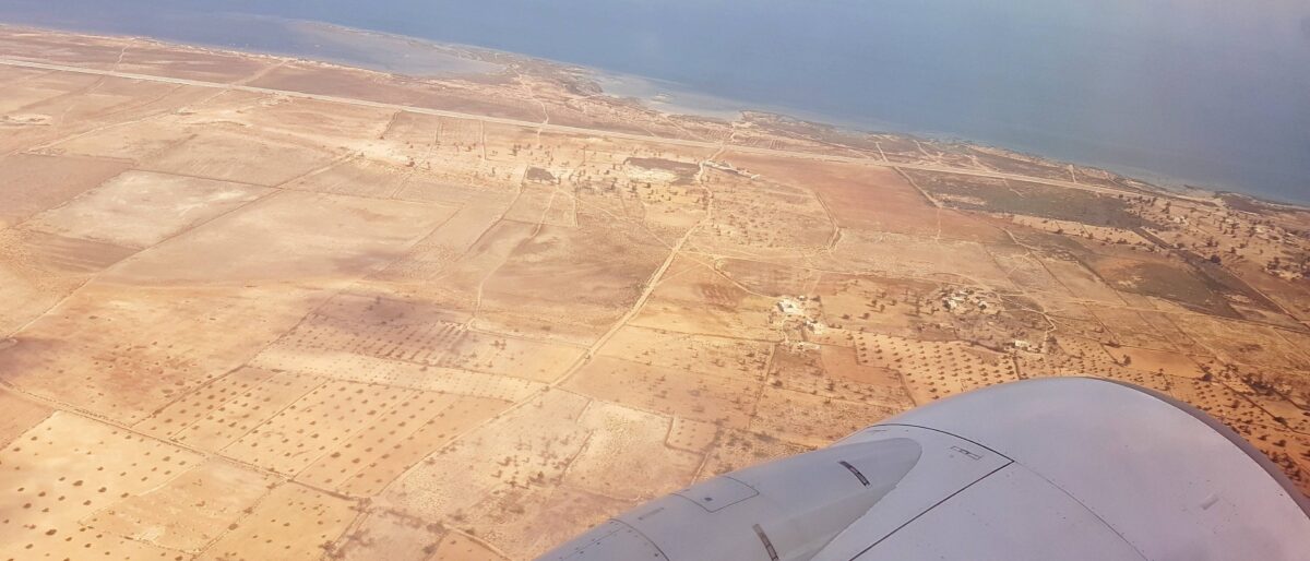 Sunny beach and turquoise sea on the island of Djerba in southern Tunisia