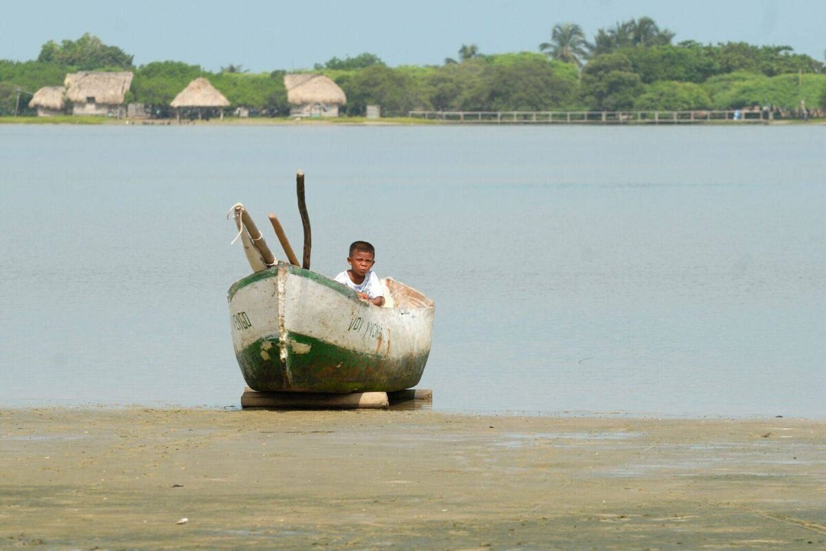 Sunrise over Cartagena’s coastline with planes in the sky and the historic city in the foreground