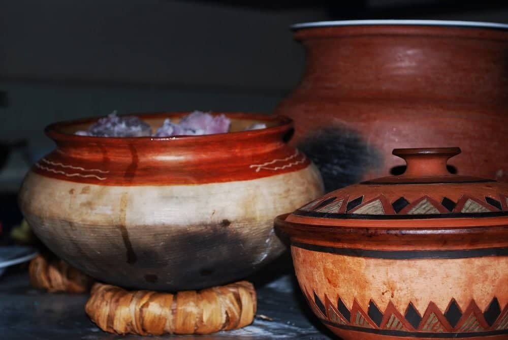 Swimming pool with sun loungers at Honey Badger Lodge surrounded by tropical gardens