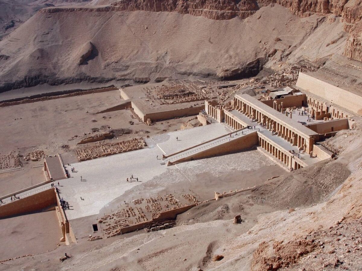 Terraced mortuary temple of Queen Hatshepsut set against desert cliffs in Luxor