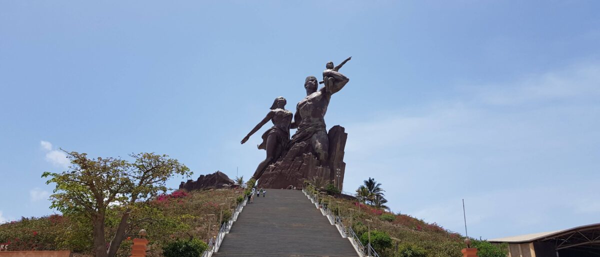 The African Renaissance Monument towering above Dakar with the Atlantic Ocean in the background